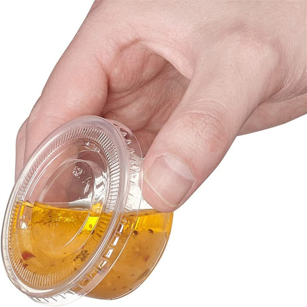 1.5 and 2 oz portion cup lid on sauce cup held upside down without spilling, leak-proof design
