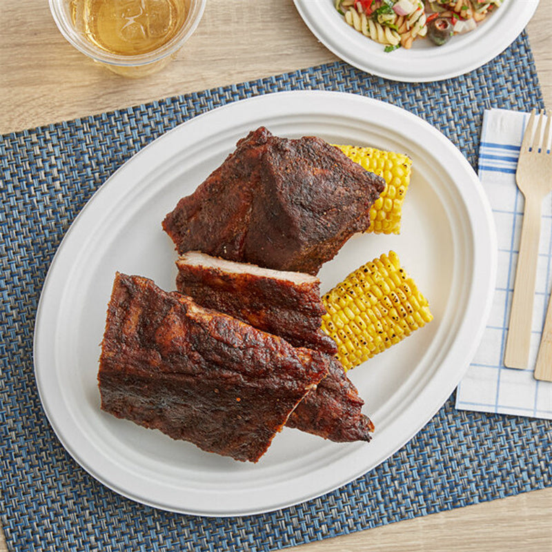 12.5 x 10 biodegradable oval plate used for serving ribs and corn eco friendly compostable food plate