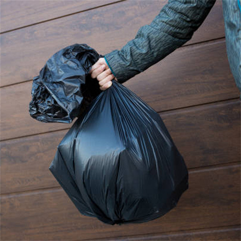 Person holding full 39 gallon trash bag – durable leak proof garbage bag for home kitchen restaurant and commercial cleaning use