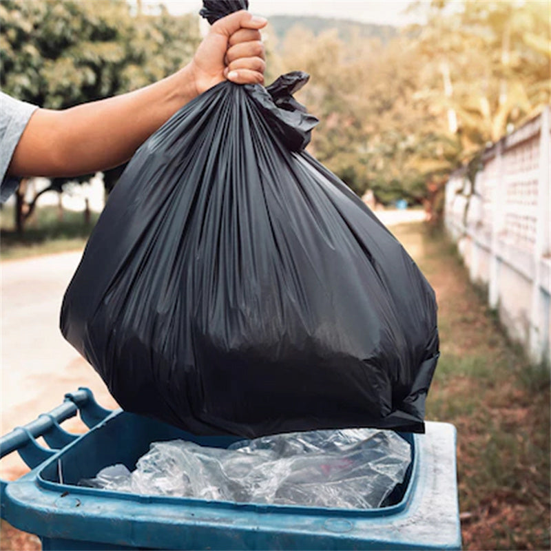 Throwing 39 gallon garbage bag into trash bin – strong tear resistant heavy duty trash bag ideal for commercial and residential waste disposal