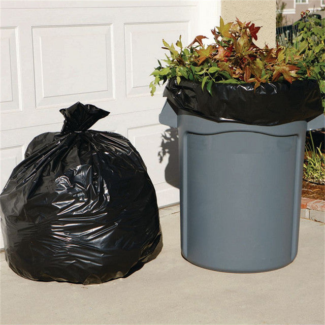46 gallon black garbage bag filled with trash next to garbage can – leak proof heavy duty trash liner for commercial and residential use